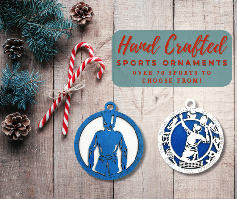 Blue and white handcrafted sports ornaments on a wooden holiday backdrop