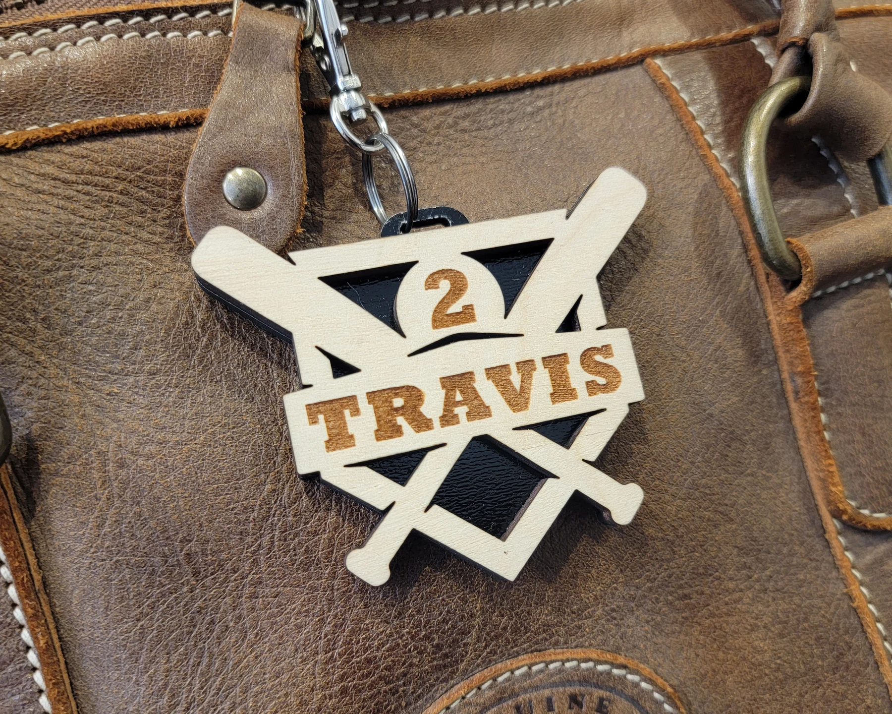 Crossed bats double layer bag tag. Supplier sample photo. Regular backing shown.