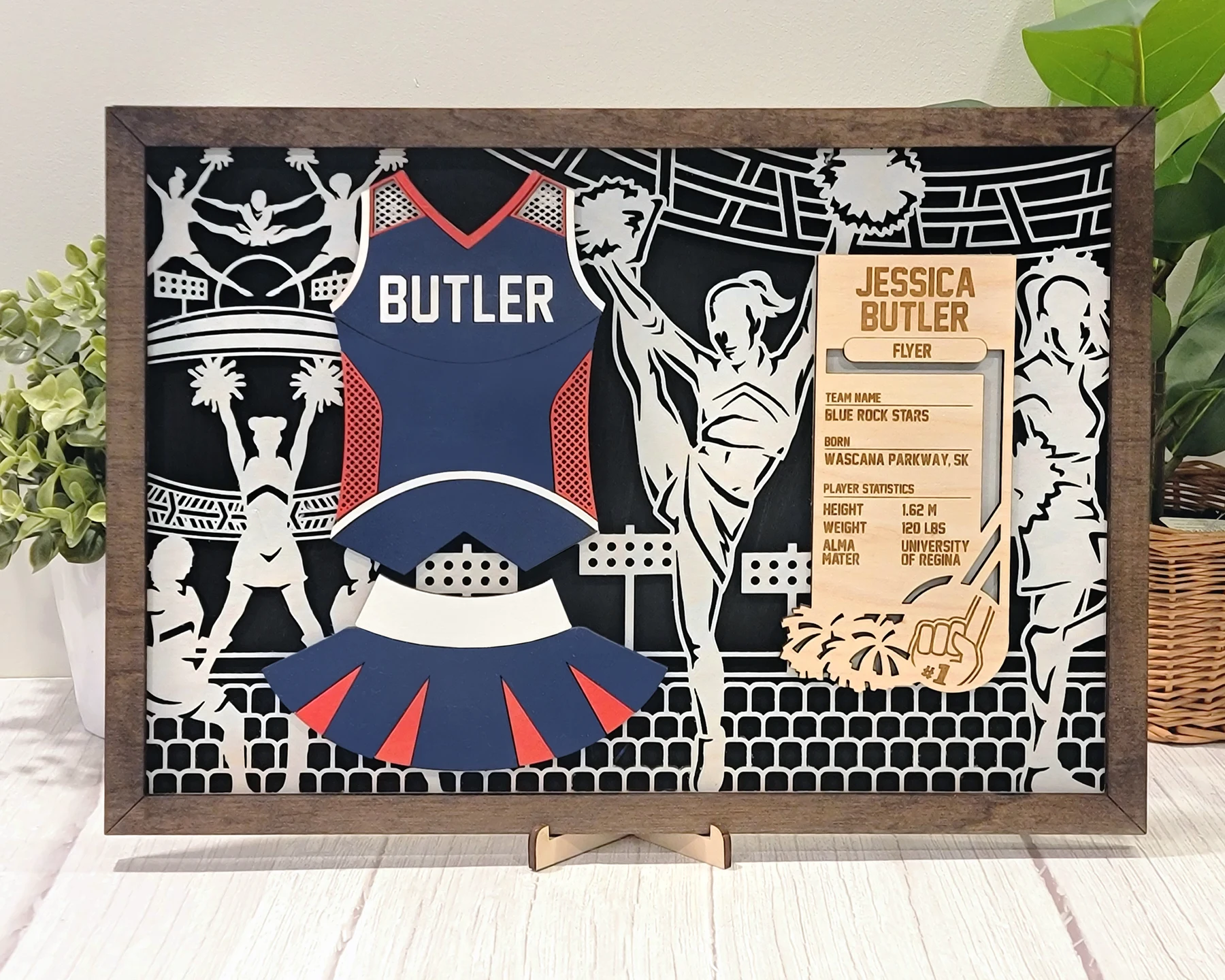 Supplier sample of a layered cheer uniform display with card holder